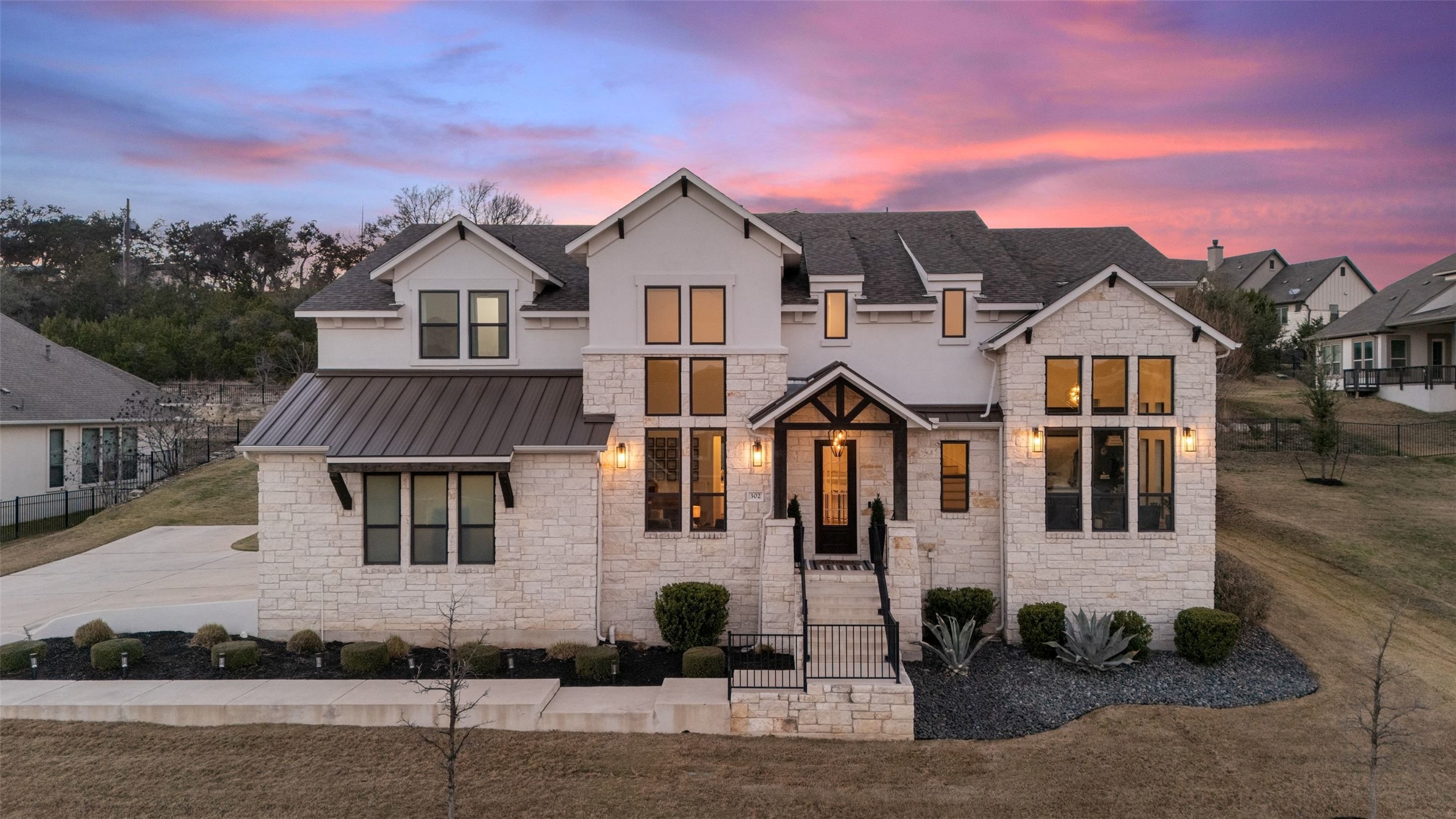 302 Lodestone Lane Austin, TX 78738 - Photo 2 of 40 a front view of a house with a yard