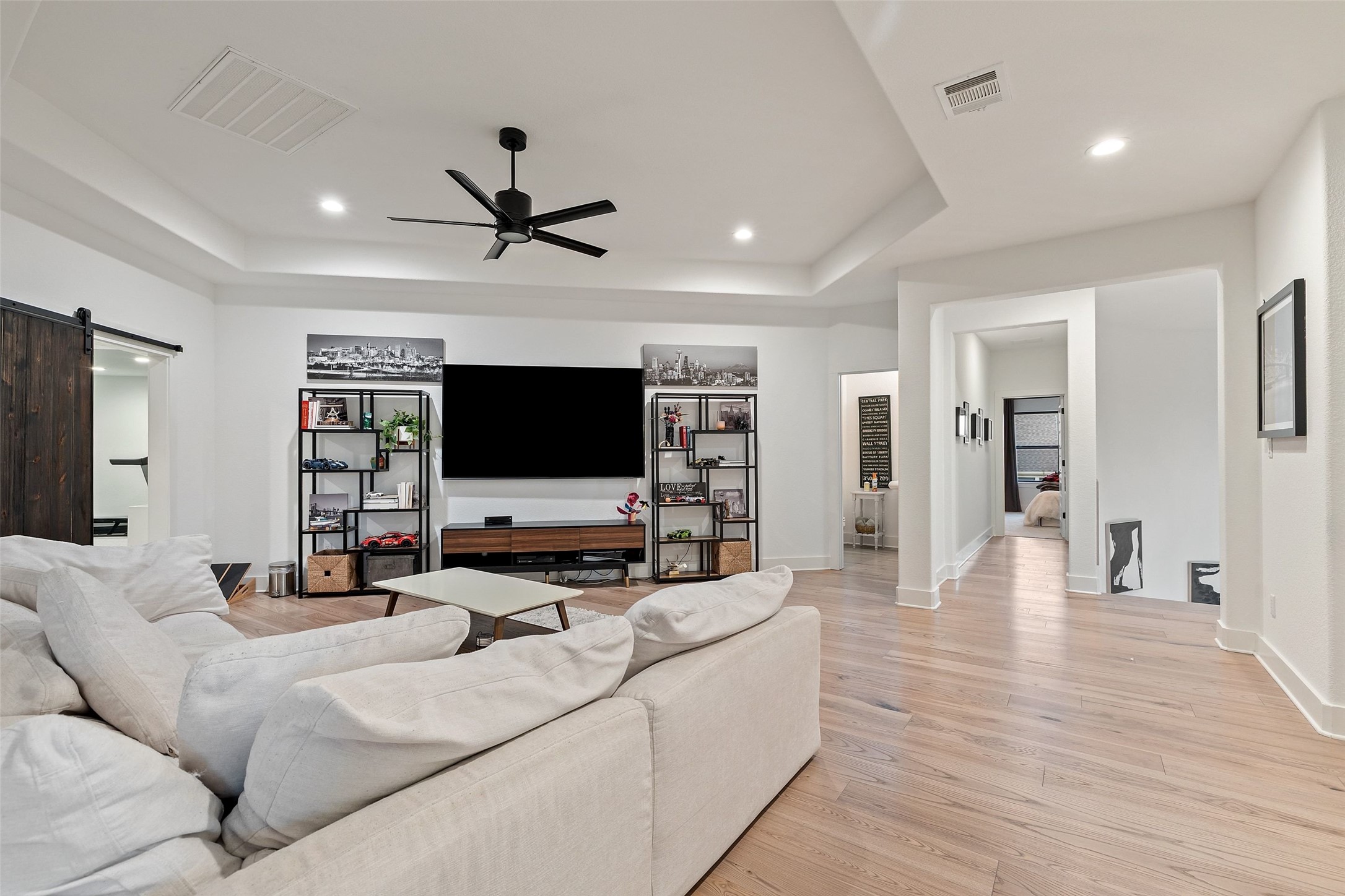 302 Lodestone Lane Austin, TX 78738 - Photo 23 of 40 a living room with furniture and a flat screen tv