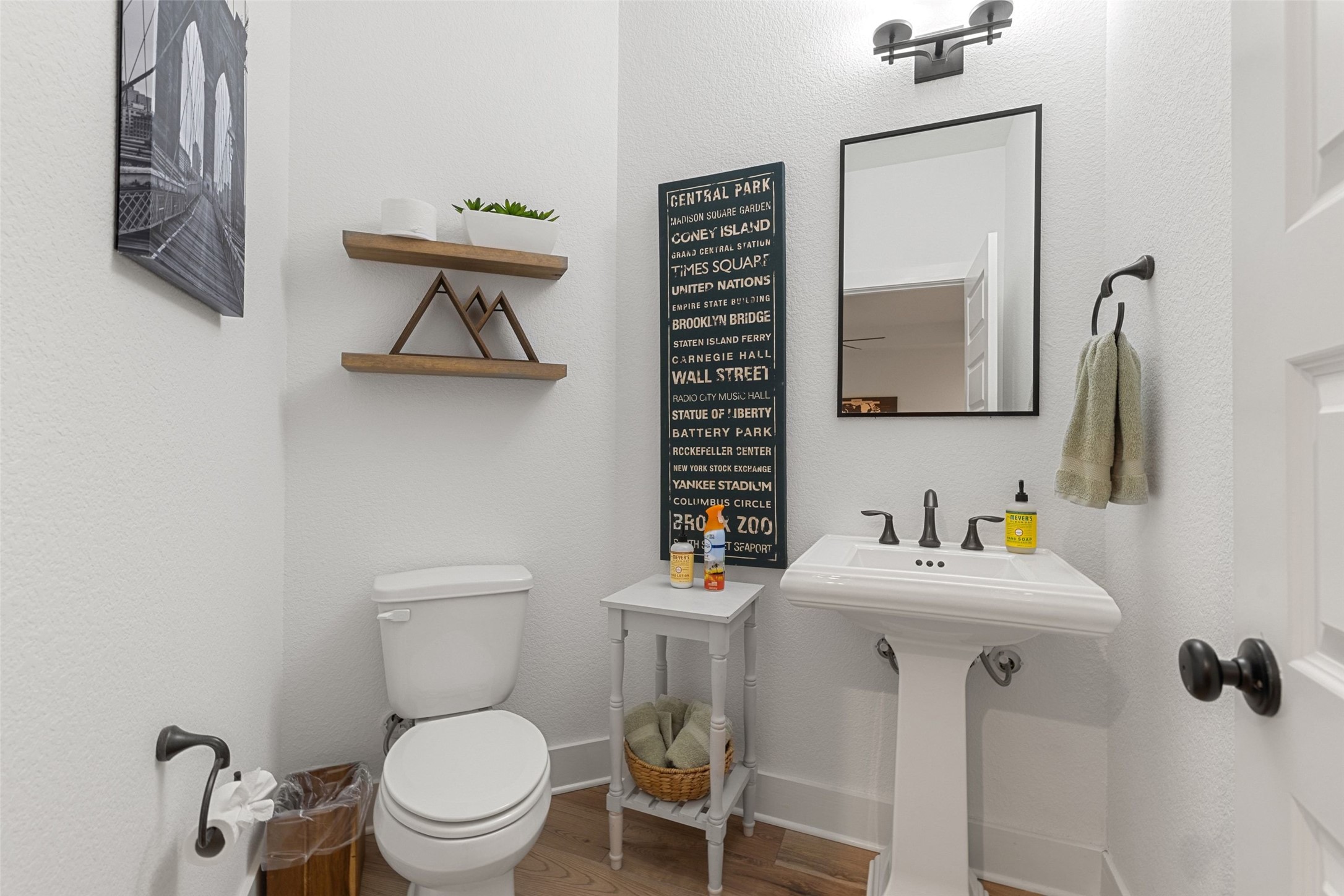 302 Lodestone Lane Austin, TX 78738 - Photo 25 of 40 a bathroom with a toilet sink and mirror