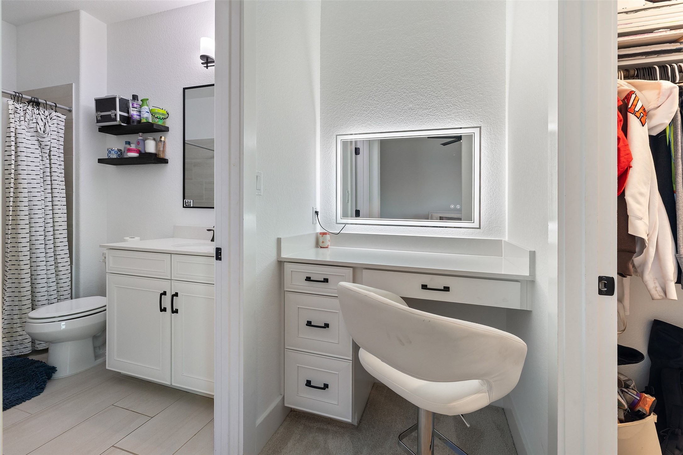 302 Lodestone Lane Austin, TX 78738 - Photo 27 of 40 a bathroom with a sink toilet and mirror
