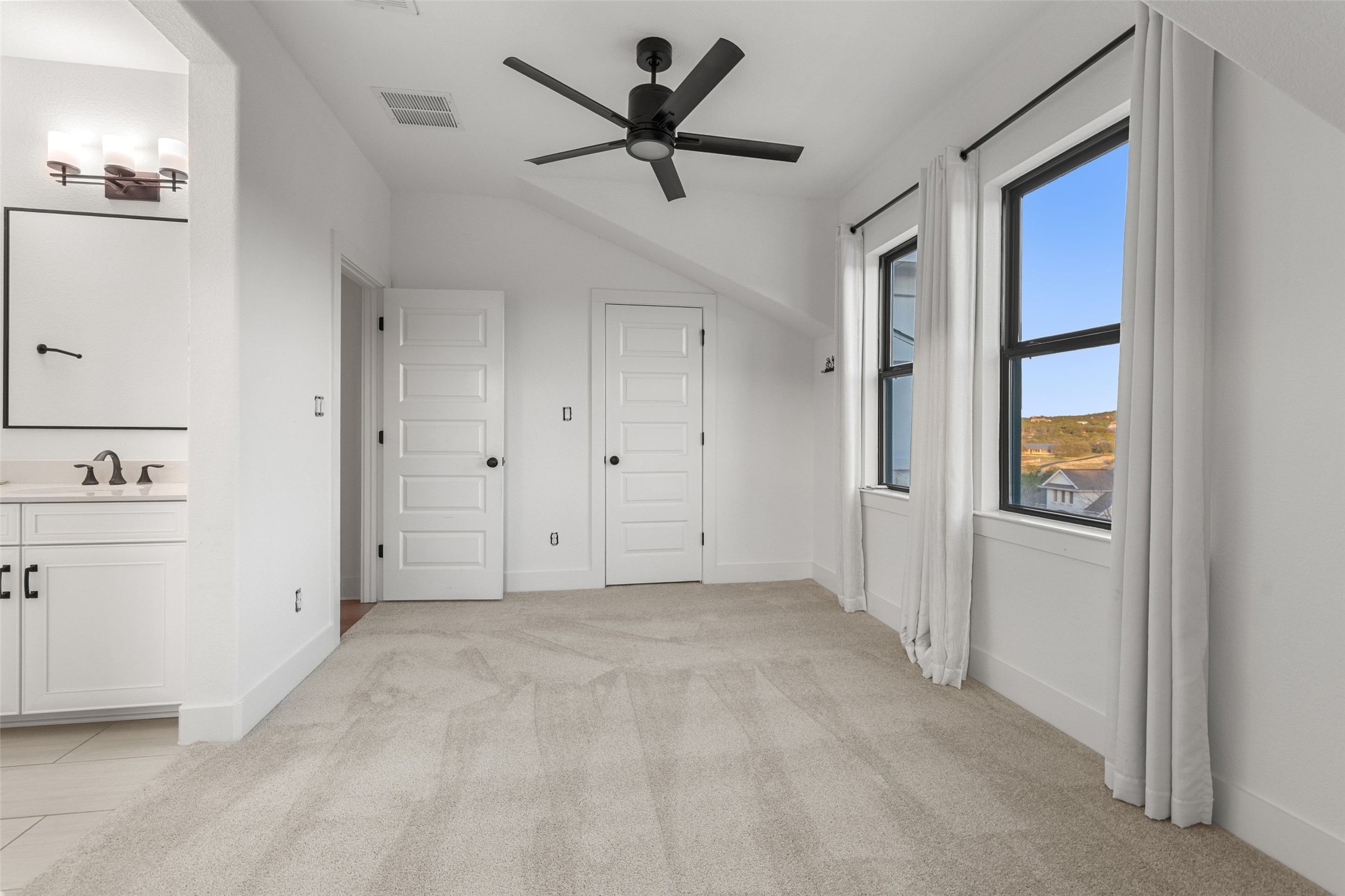 302 Lodestone Lane Austin, TX 78738 - Photo 28 of 40 a view of a livingroom with a ceiling fan