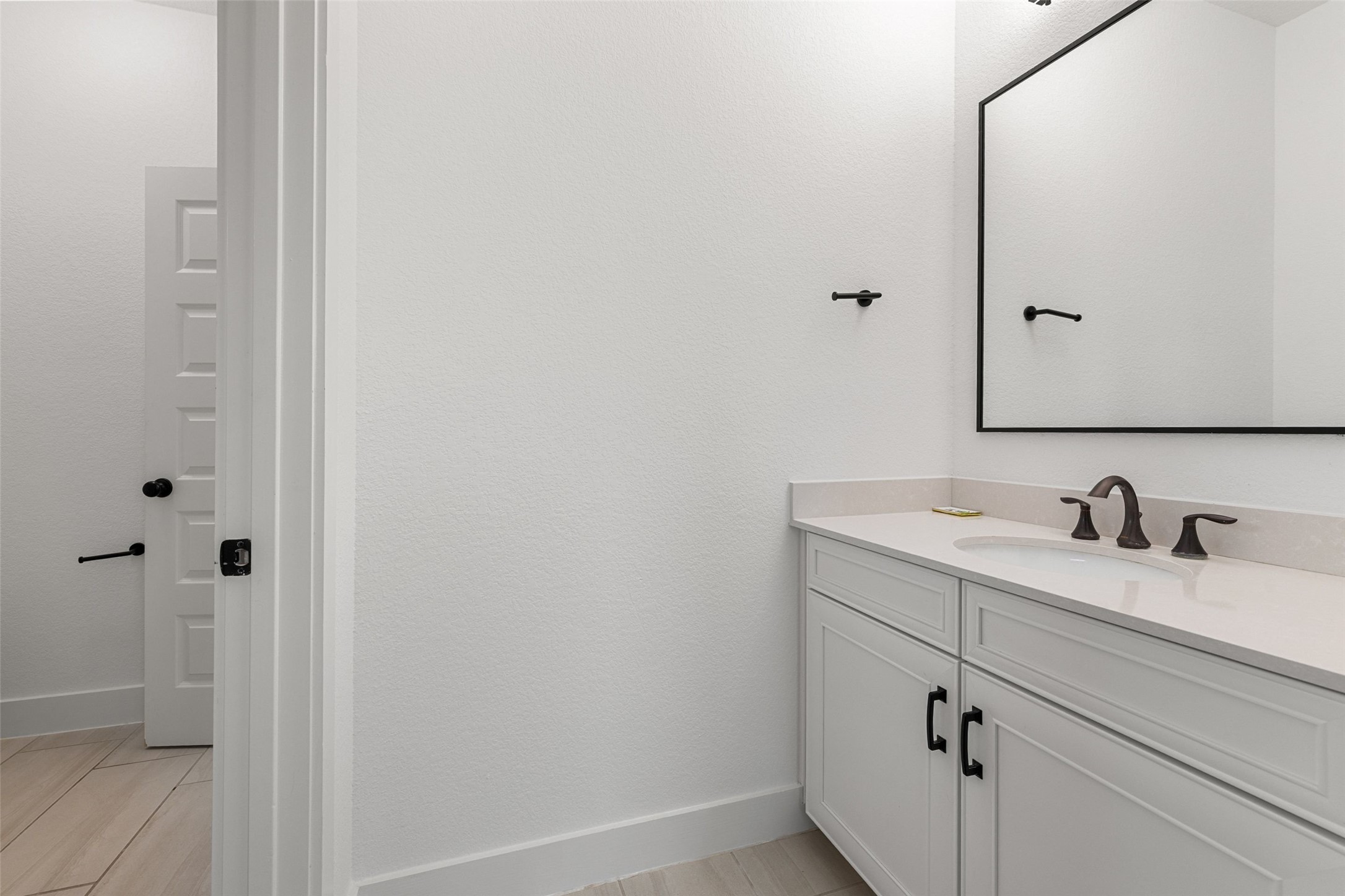 302 Lodestone Lane Austin, TX 78738 - Photo 29 of 40 a bathroom with a sink and a mirror