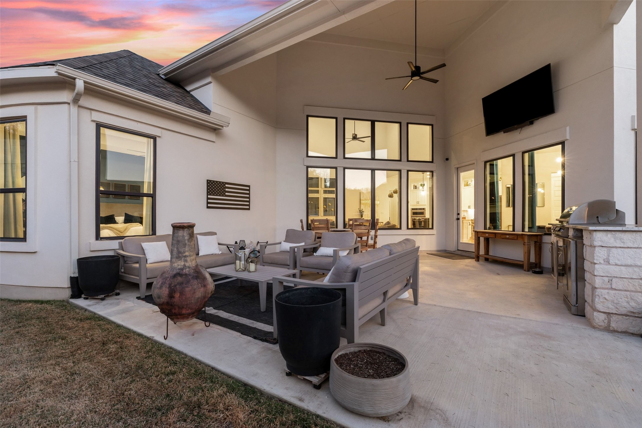 302 Lodestone Lane Austin, TX 78738 - Photo 34 of 40 a living room with furniture a flat screen tv and large windows