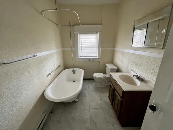 a kitchen with a refrigerator a stove top oven a sink and dishwasher