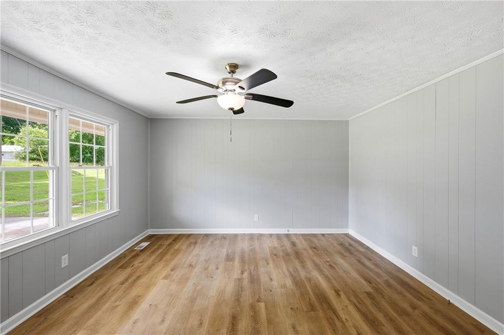 300 Cash Town Road Aragon, GA 30104 - Photo 9 of 28 an empty room with a window and a ceiling fan
