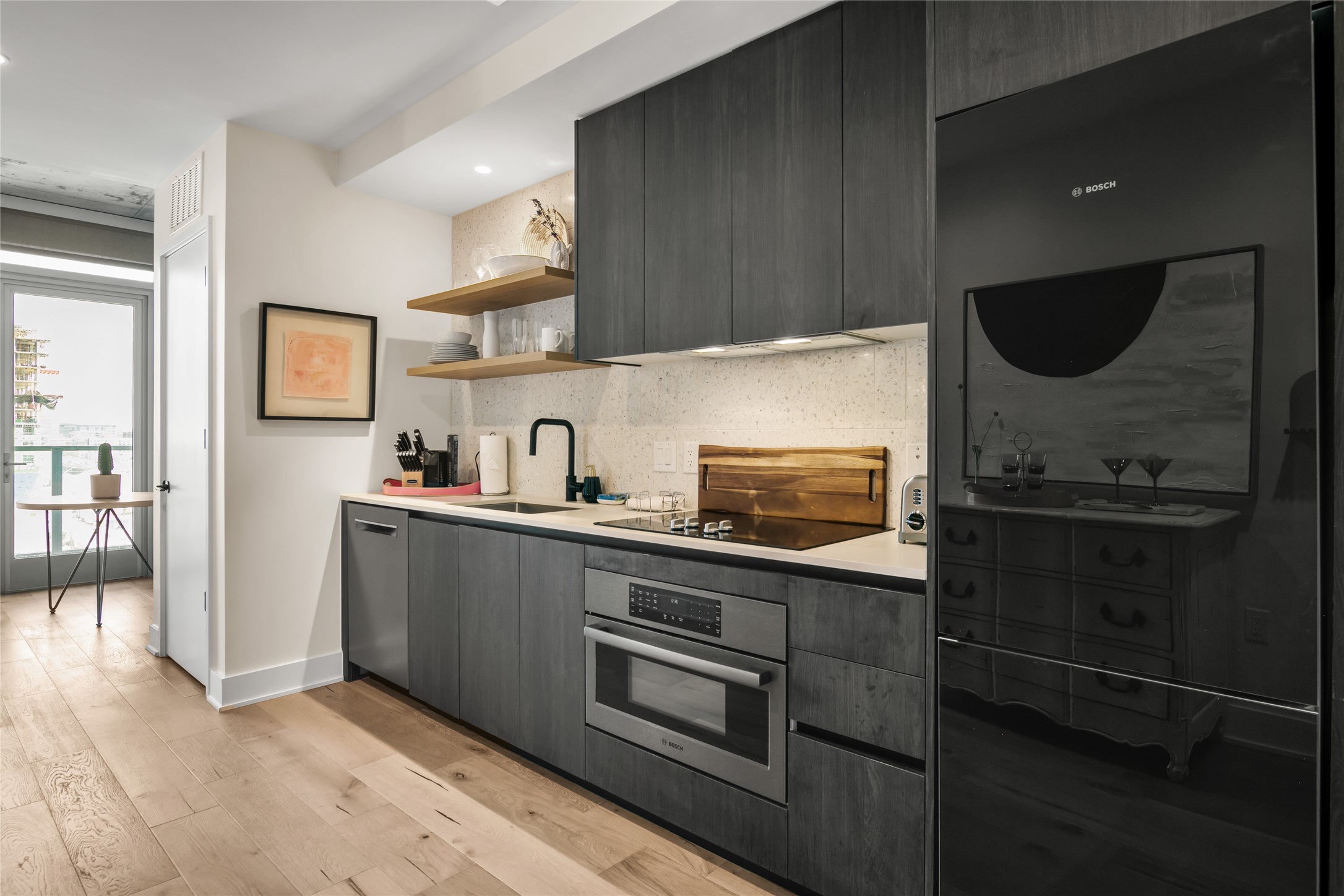 48 East Avenue, Unit 1102 Austin, TX 78701 - Photo 3 of 13 a kitchen with stainless steel appliances a stove microwave and sink
