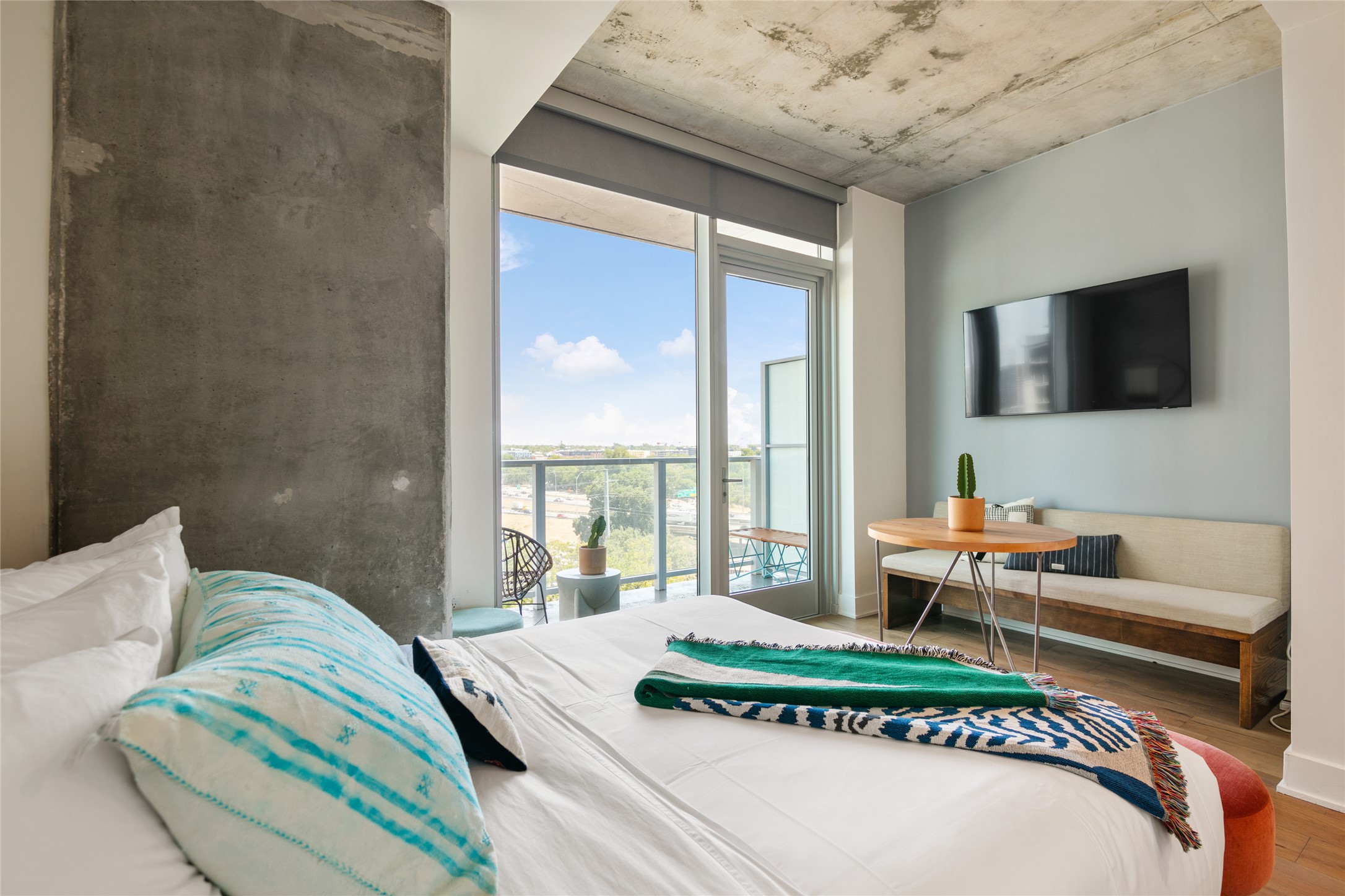 48 East Avenue, Unit 1102 Austin, TX 78701 - Photo 6 of 13 a living room with furniture and a flat screen tv