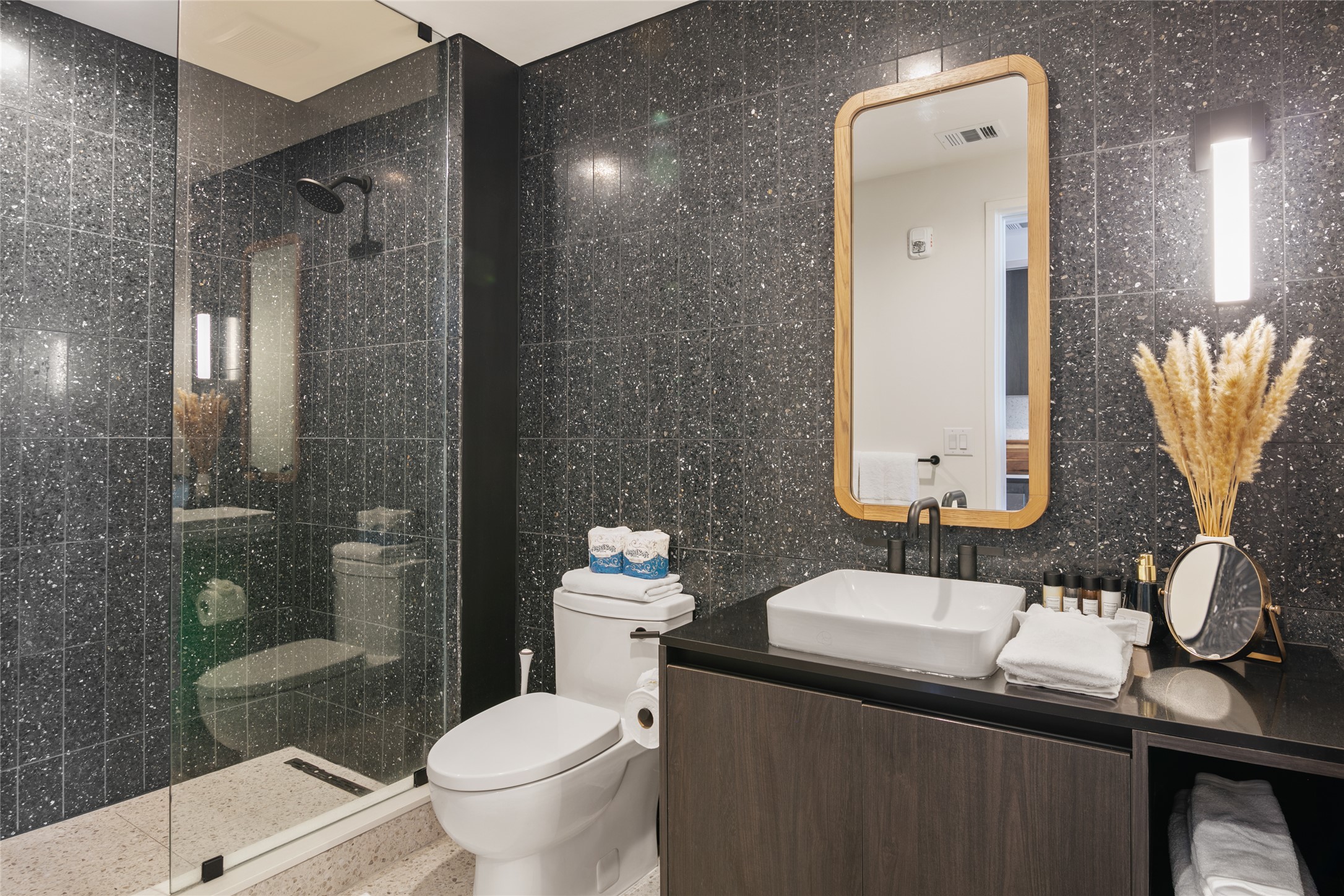 48 East Avenue, Unit 1102 Austin, TX 78701 - Photo 10 of 13 a bathroom with a sink toilet and shower