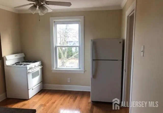 a view of kitchen with furniture and a window