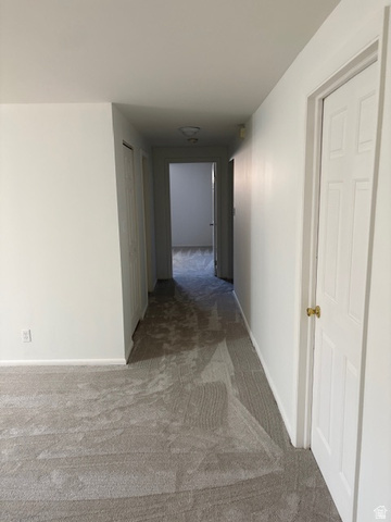 2313 150 East Bountiful, UT 84010 - Photo 29 of 39 Hallway with light gray carpeting and white painted walls