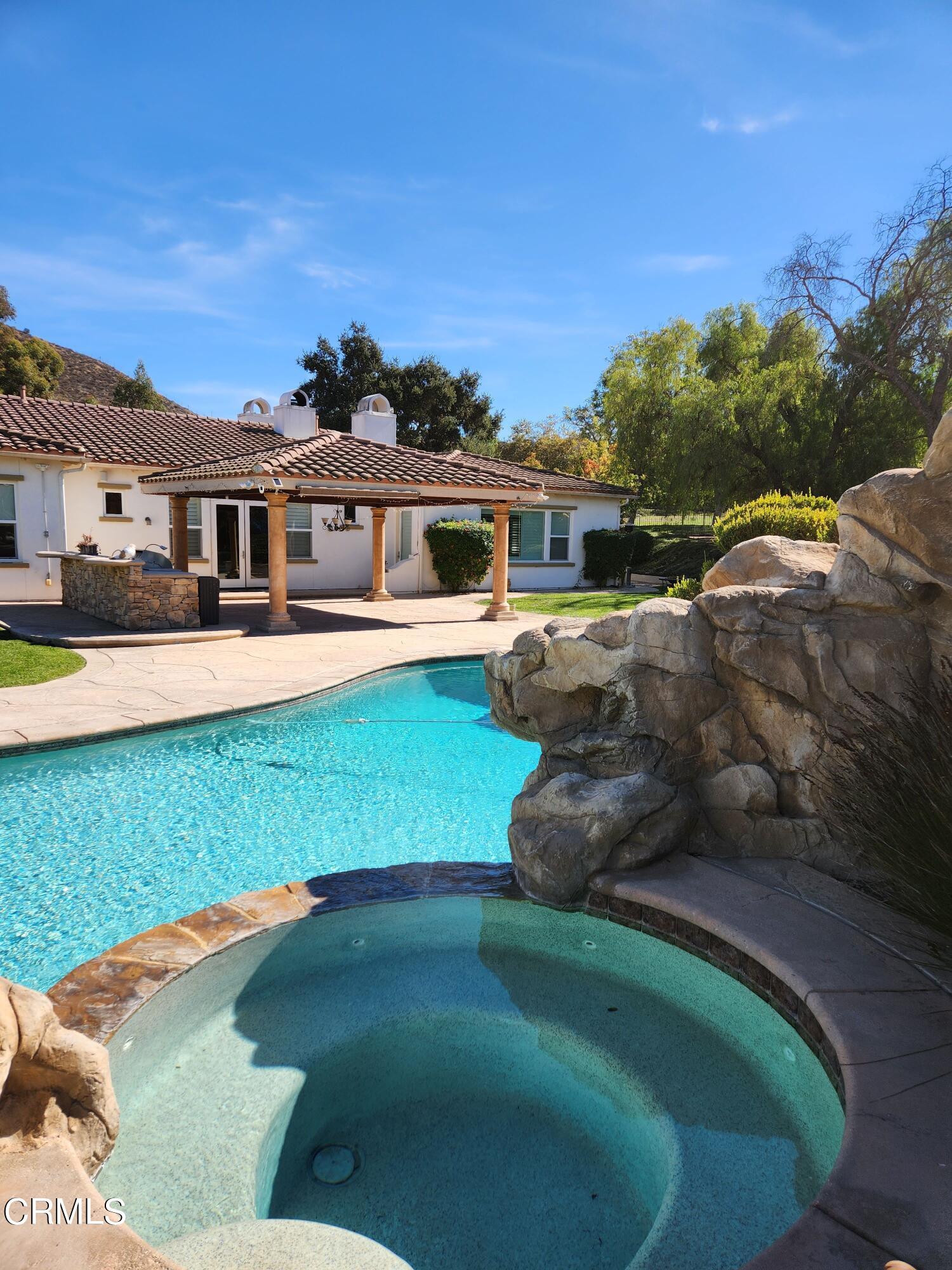 1915 Maya Pradera Lane Moorpark, CA 93021 - Photo 12 of 39 a front view of a house with a yard table and chairs