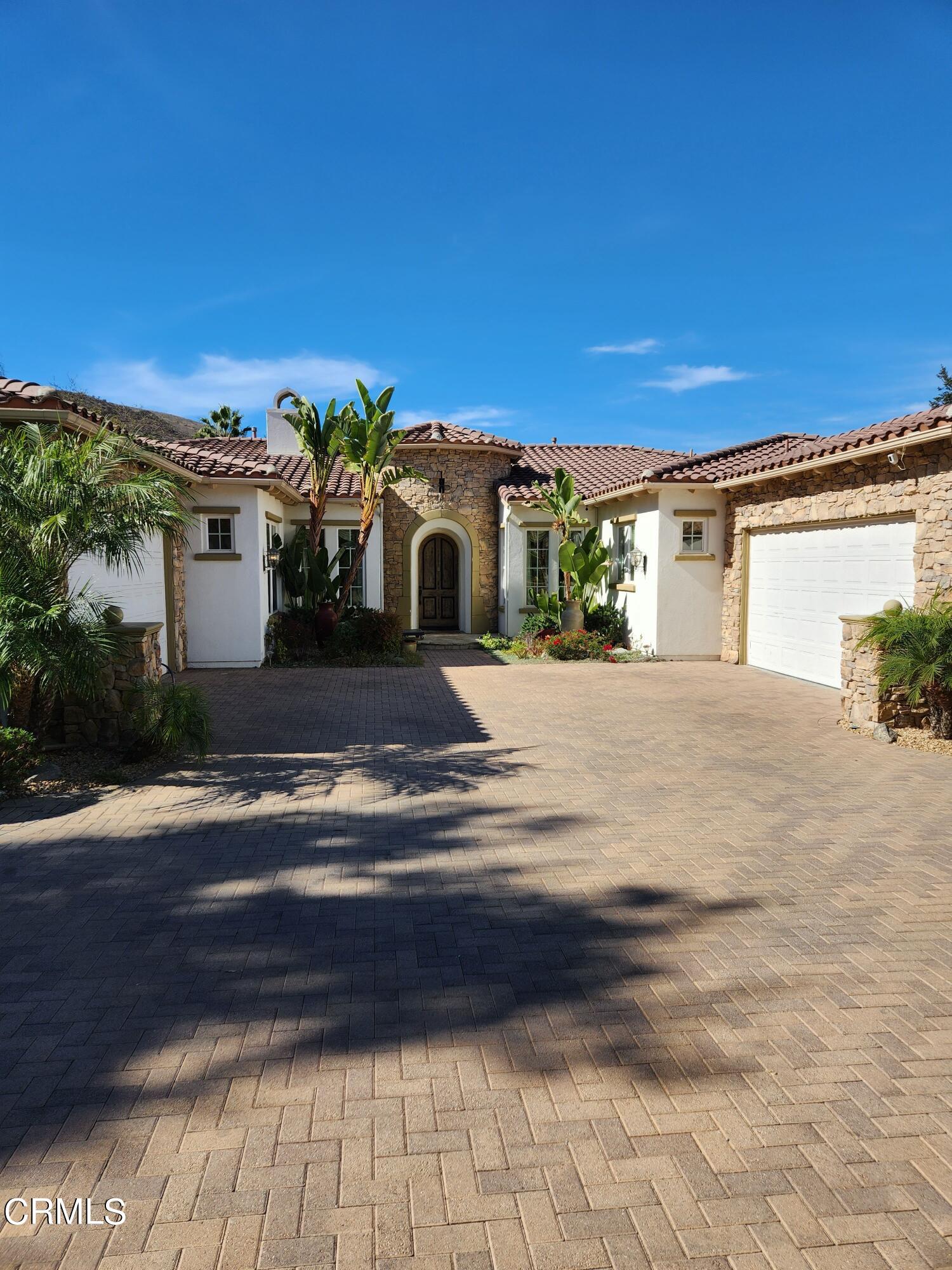 1915 Maya Pradera Lane Moorpark, CA 93021 - Photo 16 of 39 a front view of a house with a yard
