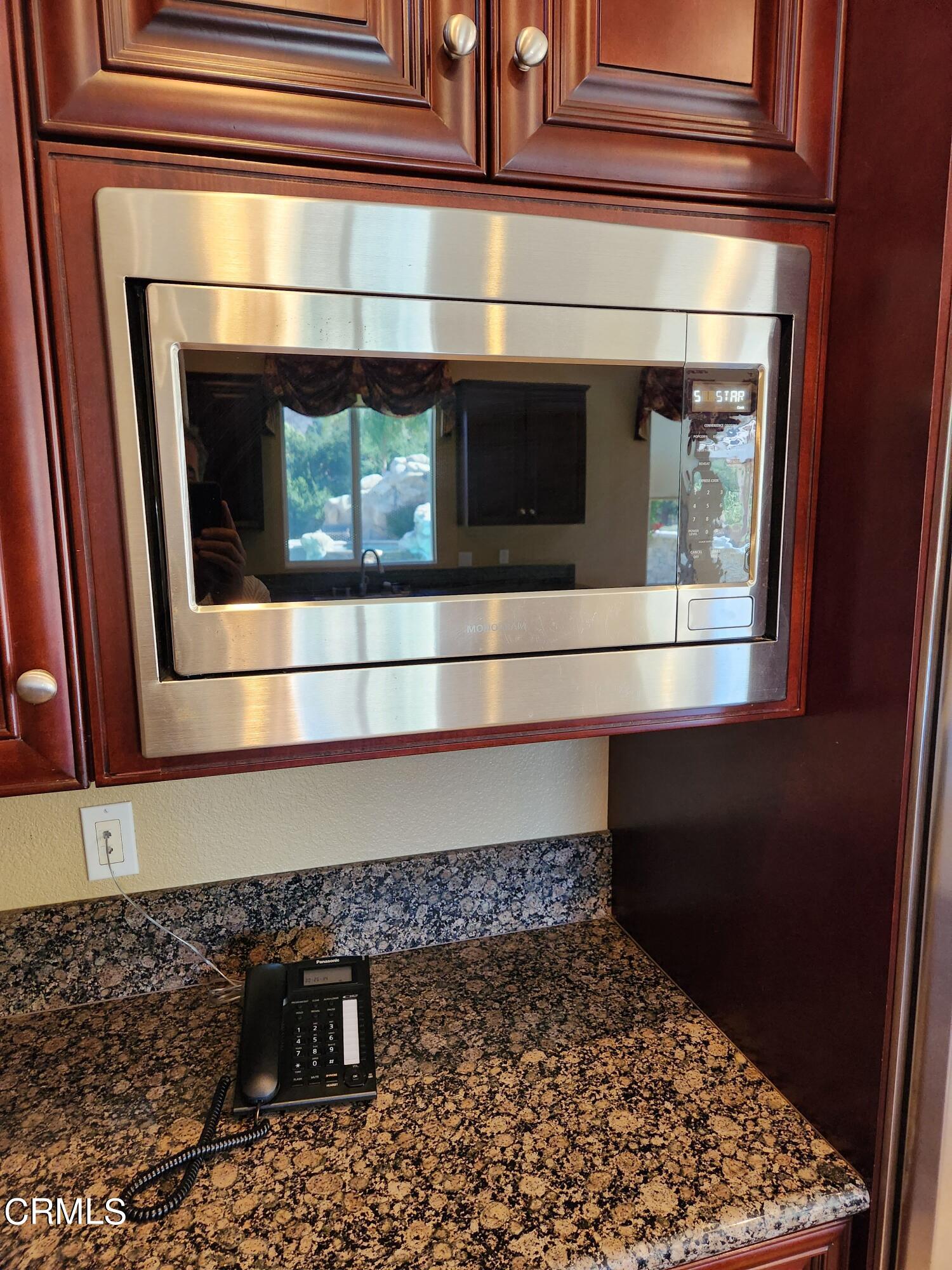 1915 Maya Pradera Lane Moorpark, CA 93021 - Photo 24 of 39 a bathroom with a sink and a stove