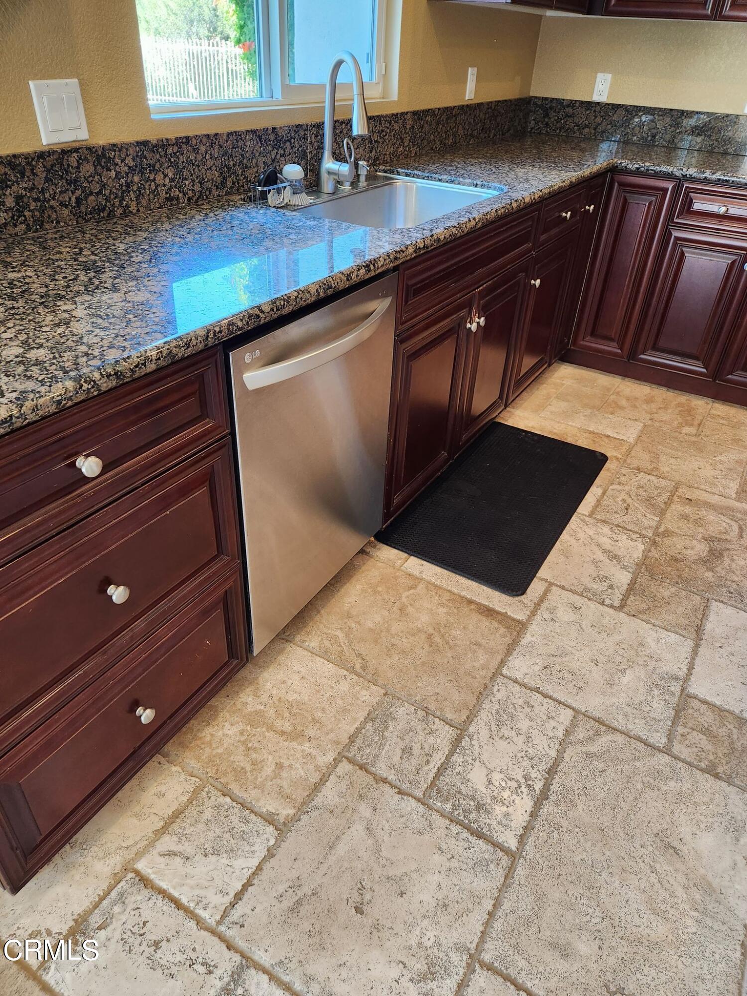 1915 Maya Pradera Lane Moorpark, CA 93021 - Photo 25 of 39 a kitchen with a sink and cabinets