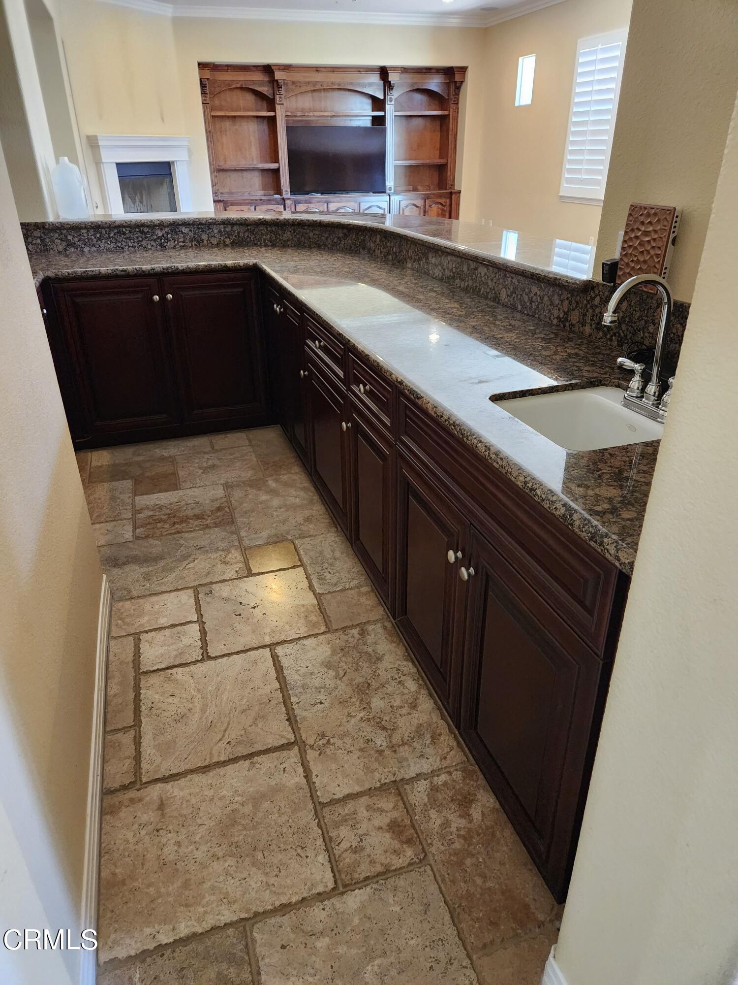 1915 Maya Pradera Lane Moorpark, CA 93021 - Photo 27 of 39 a kitchen with granite countertop a sink and a stove