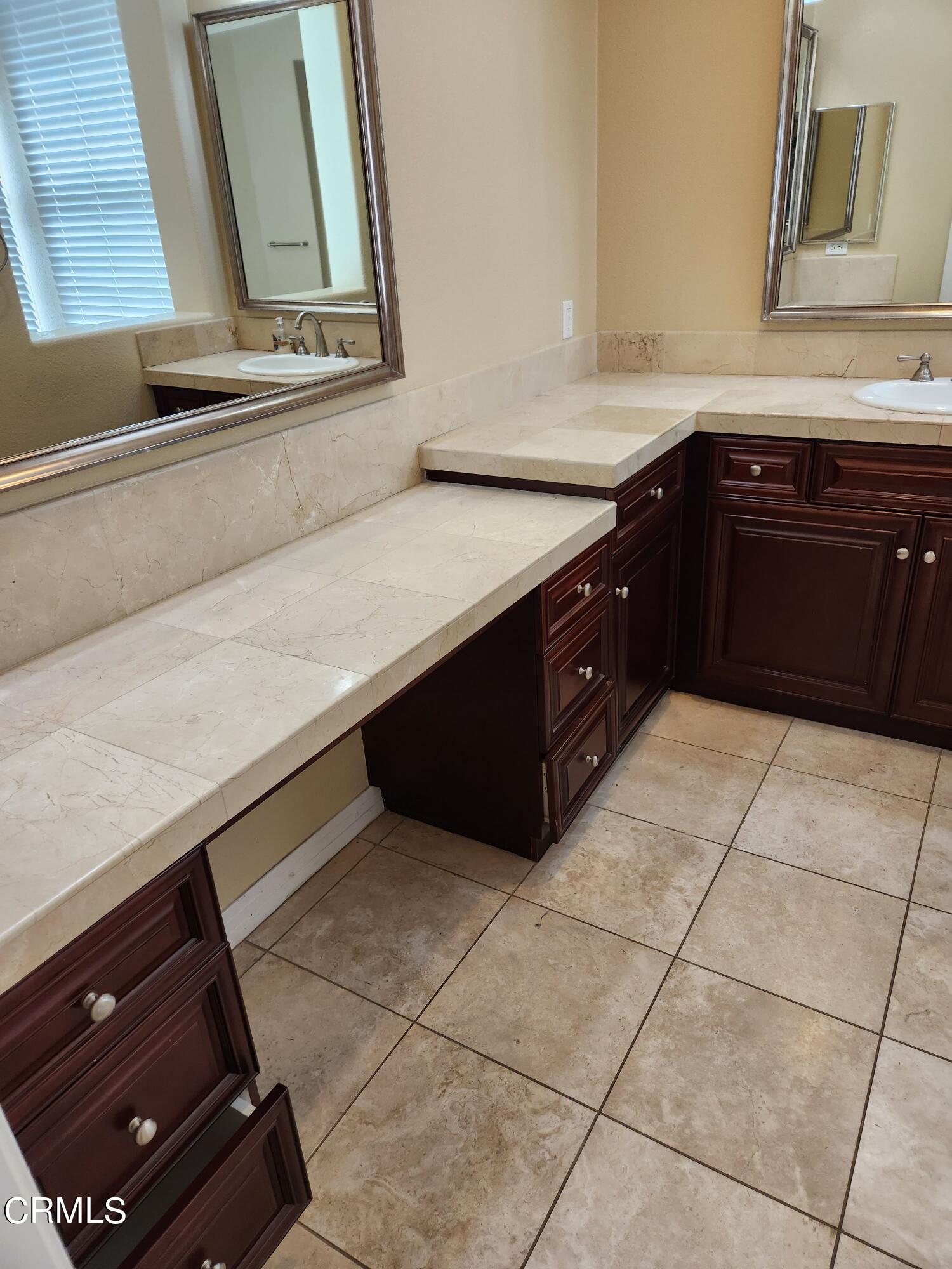 1915 Maya Pradera Lane Moorpark, CA 93021 - Photo 30 of 39 a kitchen with a sink a stove and a microwave
