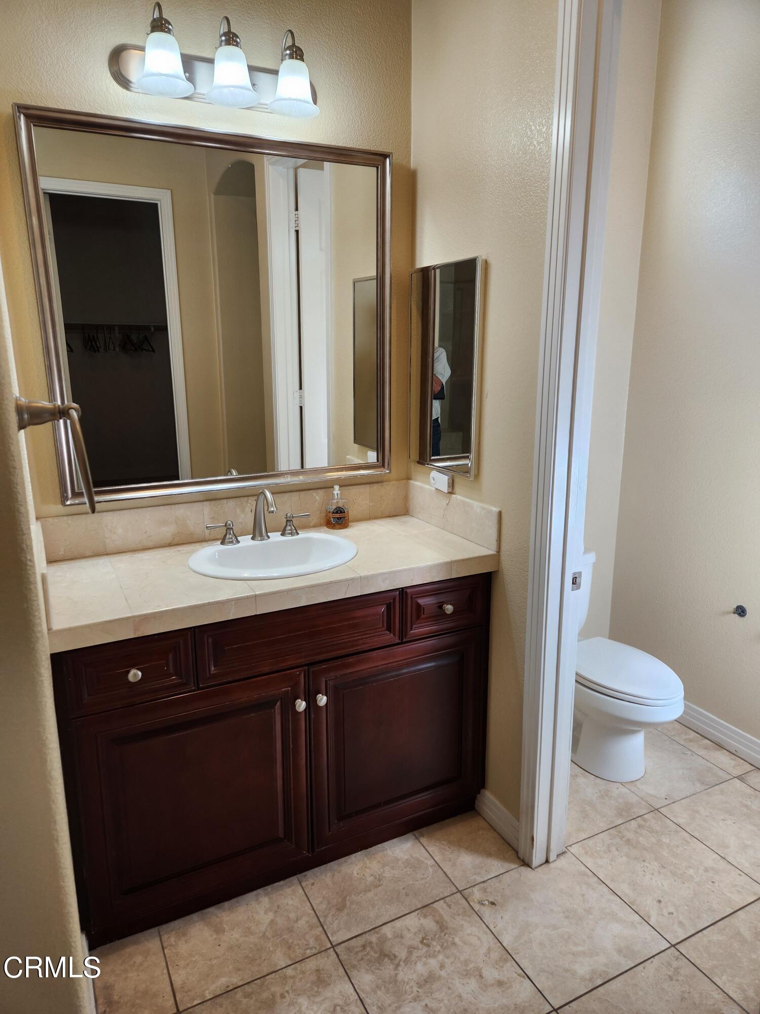 1915 Maya Pradera Lane Moorpark, CA 93021 - Photo 32 of 39 a bathroom with a sink vanity and toilet
