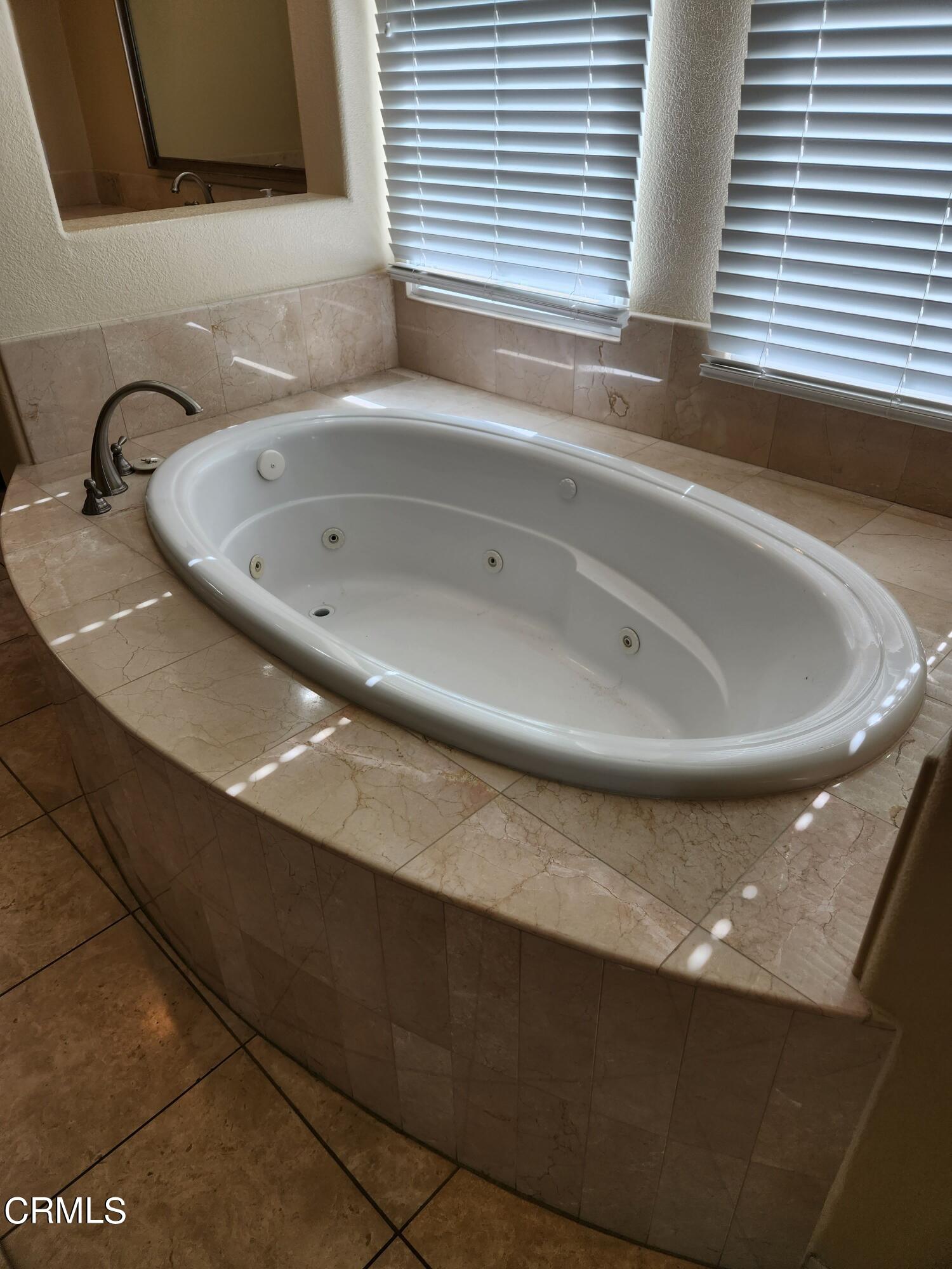 1915 Maya Pradera Lane Moorpark, CA 93021 - Photo 34 of 39 a bathroom with a sink and a bathtub