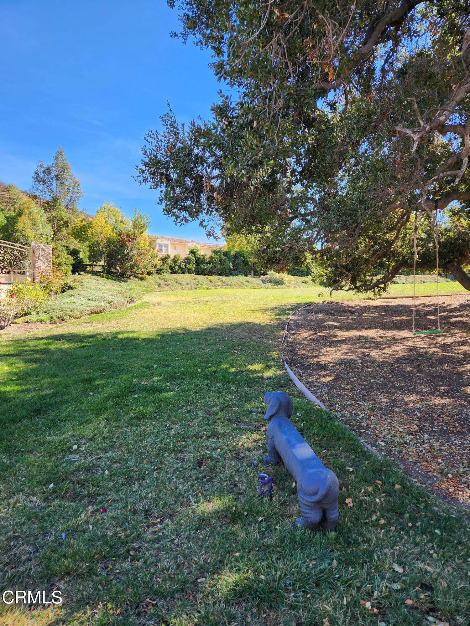 1915 Maya Pradera Lane Moorpark, CA 93021 - Photo 4 of 39 a view of a yard with a slide