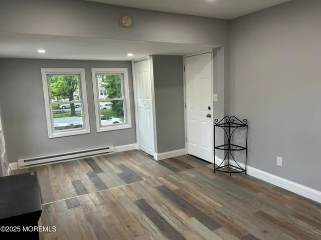 a view of an empty room with a window