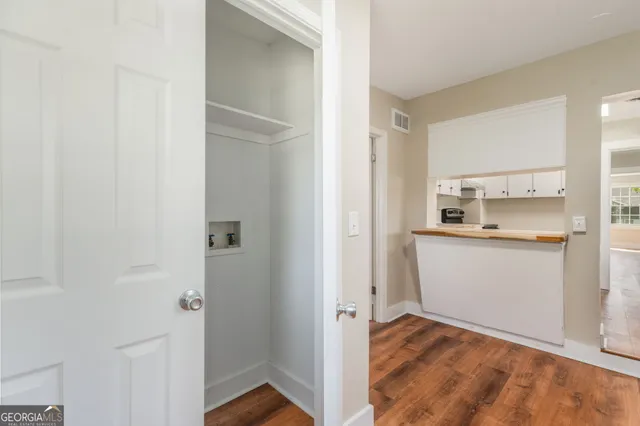 a view of kitchen with wooden floor