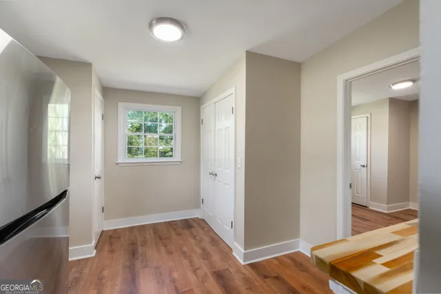 wooden floor in an empty room with a window