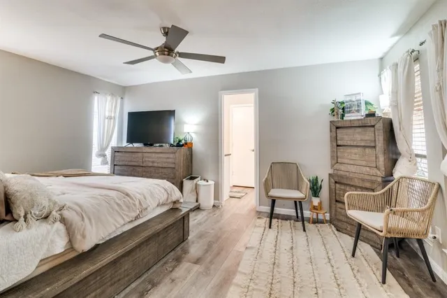 a bedroom with a bed and a chair