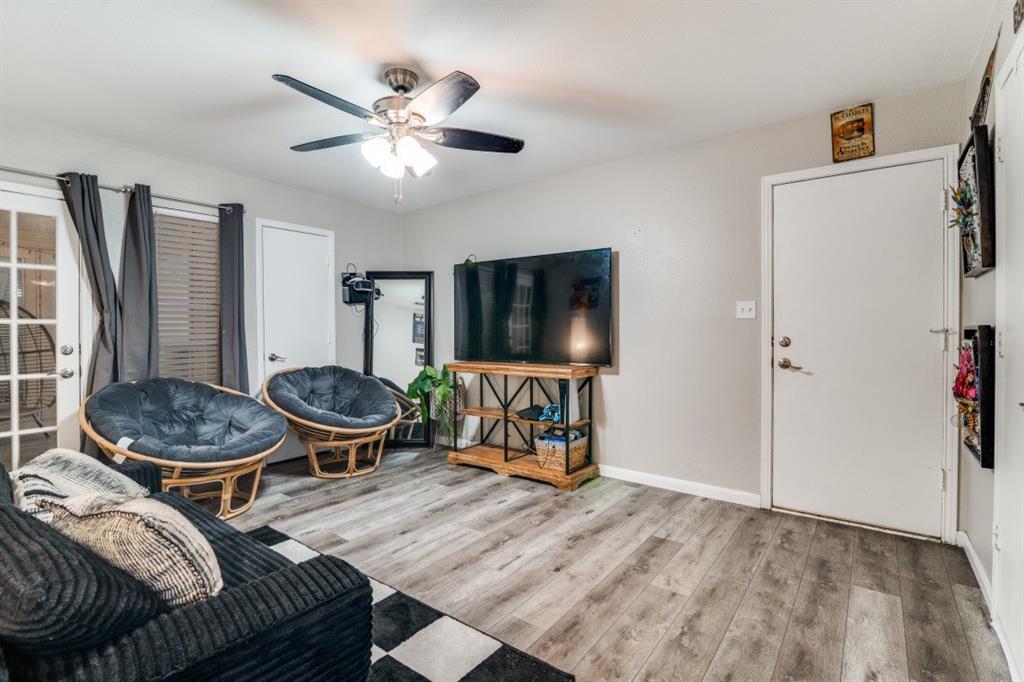 7214 Ridgeview Drive Rowlett, TX 75089 - Photo 9 of 23 a living room with furniture and a flat screen tv