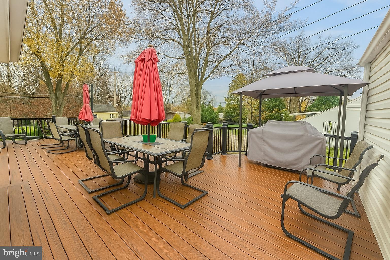 1204 Vilsmeier Road Lansdale, PA 19446 - Photo 22 of 26 Spacious deck with vibrant umbrellas.