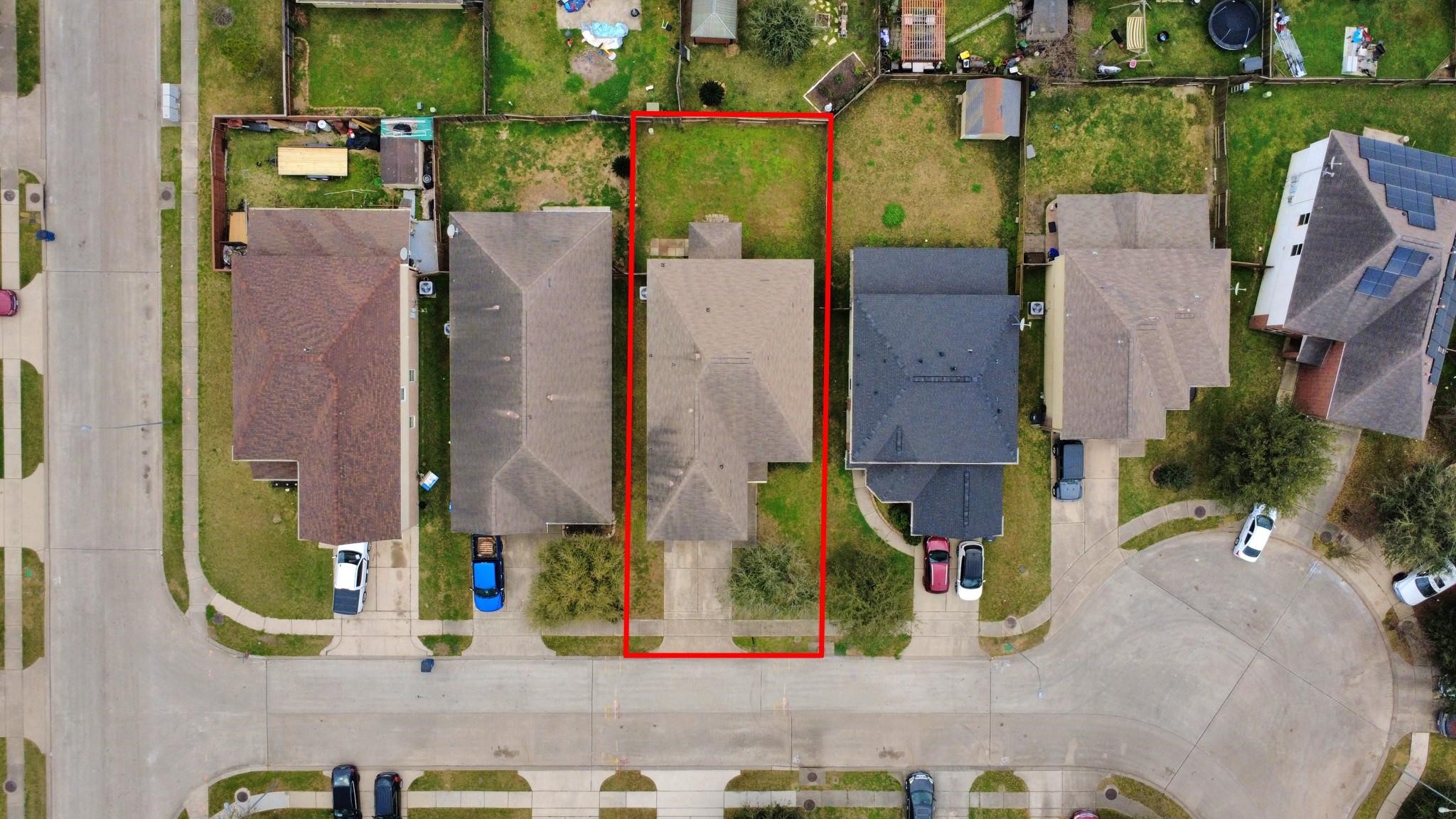 11014 Cape Rise Trail Houston, TX 77044 - Photo 41 of 43 Aerial perspective highlighting the property’s generous lot and fenced backyard. The outlined boundaries clearly showcase the home’s footprint and outdoor space within the peaceful neighborhood setting.