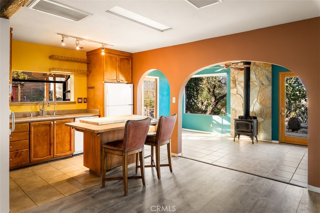 66075 Foothill Drive Joshua Tree, CA 92252 - Photo 14 of 53 a view of a dining room with furniture and a large window