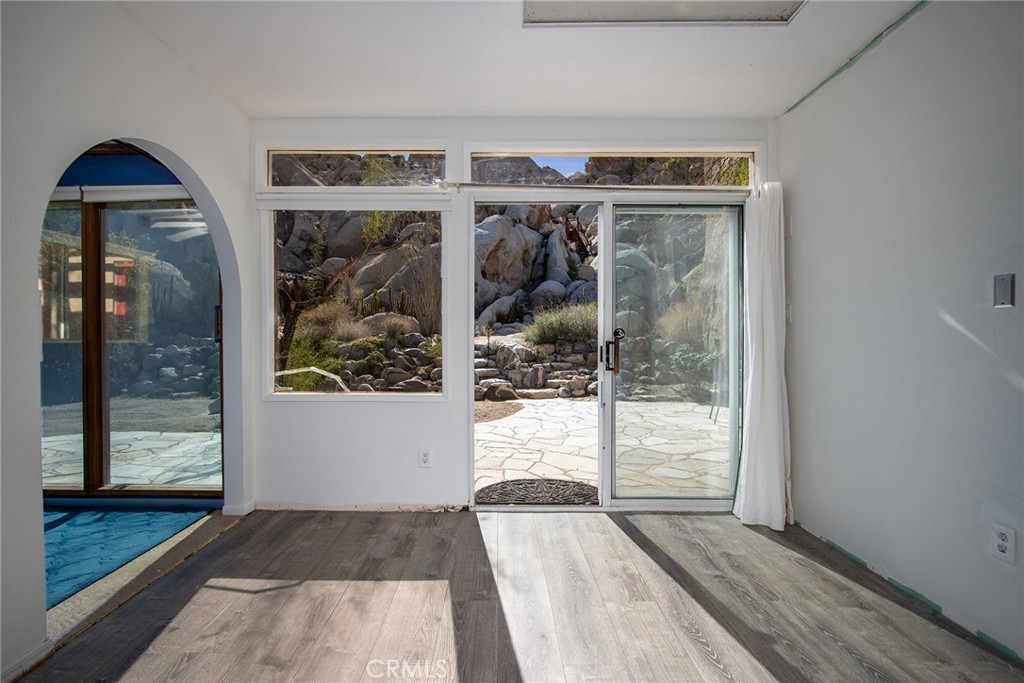 66075 Foothill Drive Joshua Tree, CA 92252 - Photo 20 of 53 a view of wooden door of the house