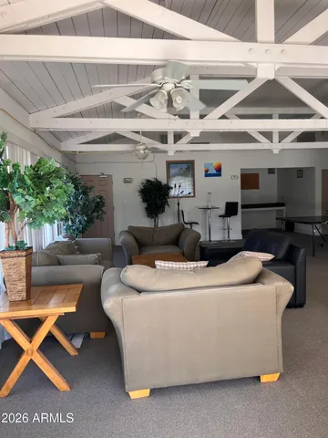 a living room with furniture a dining table and chairs