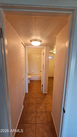 a bathroom with a sink and a glass door shower