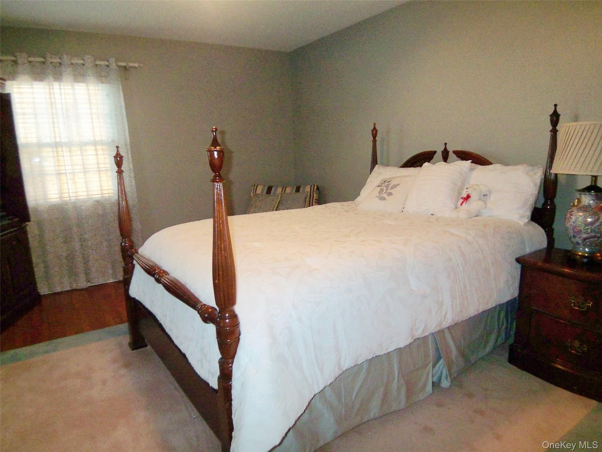 40 Harding Parkway Mount Vernon, NY 10552 - Photo 20 of 35 View of carpeted bedroom, hardwood floors