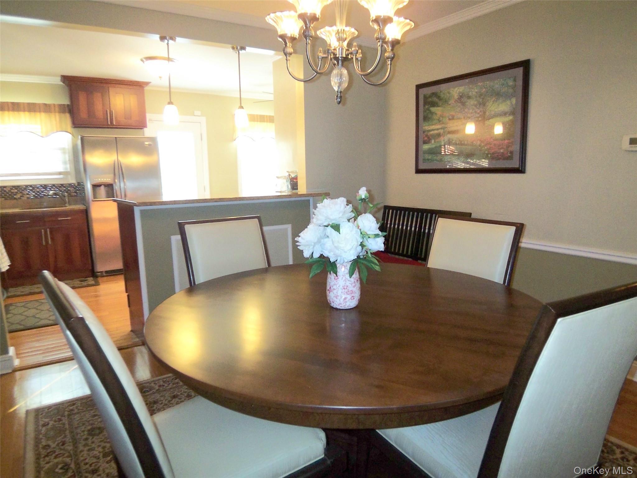 40 Harding Parkway Mount Vernon, NY 10552 - Photo 9 of 35 Dining space featuring suspended lighting and ornamental molding