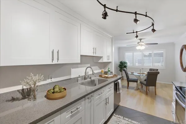 a kitchen with sink cabinets and window