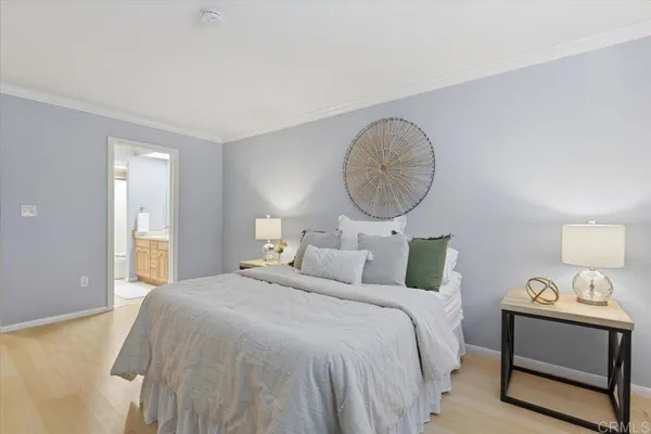 a bedroom with bed and a window
