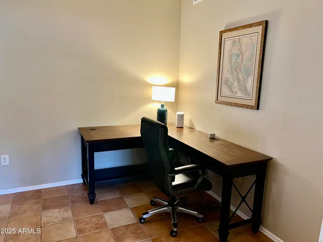 a view of a workspace with furniture