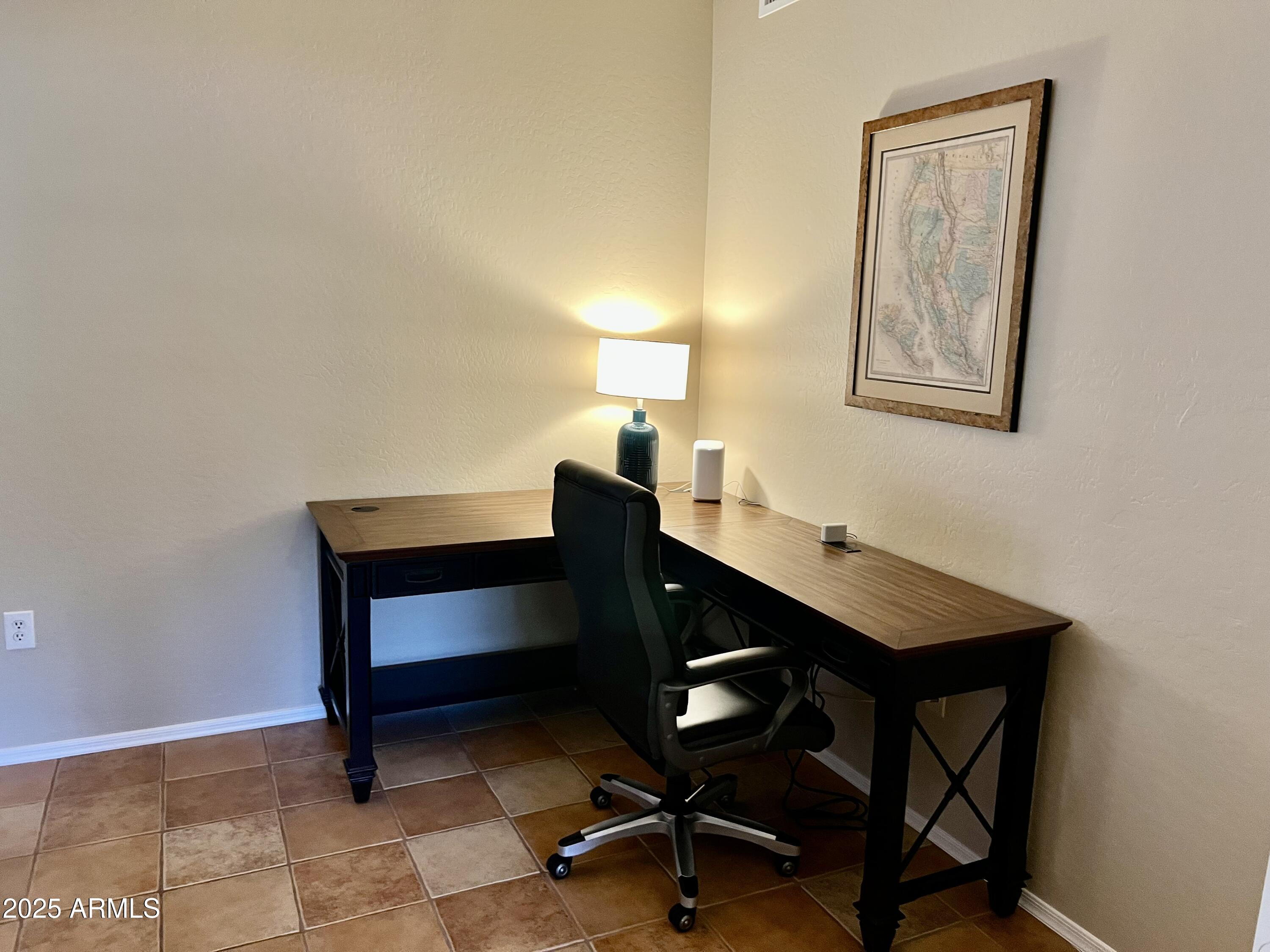 19700 North 76th Street, Unit 1103 Scottsdale, AZ 85255 - Photo 5 of 18 a view of a workspace with furniture