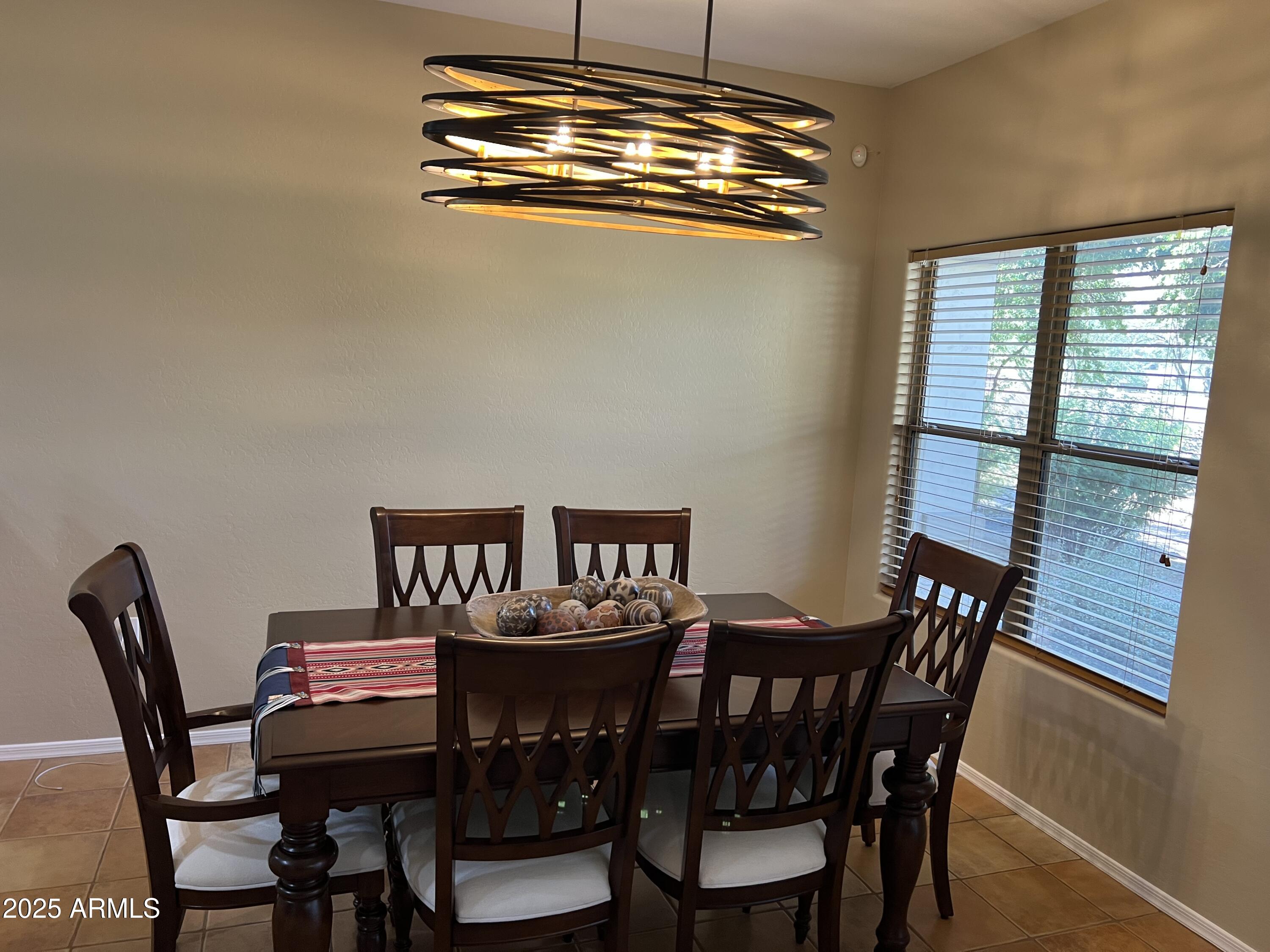 19700 North 76th Street, Unit 1103 Scottsdale, AZ 85255 - Photo 7 of 18 a view of a dining room with furniture window and outside view