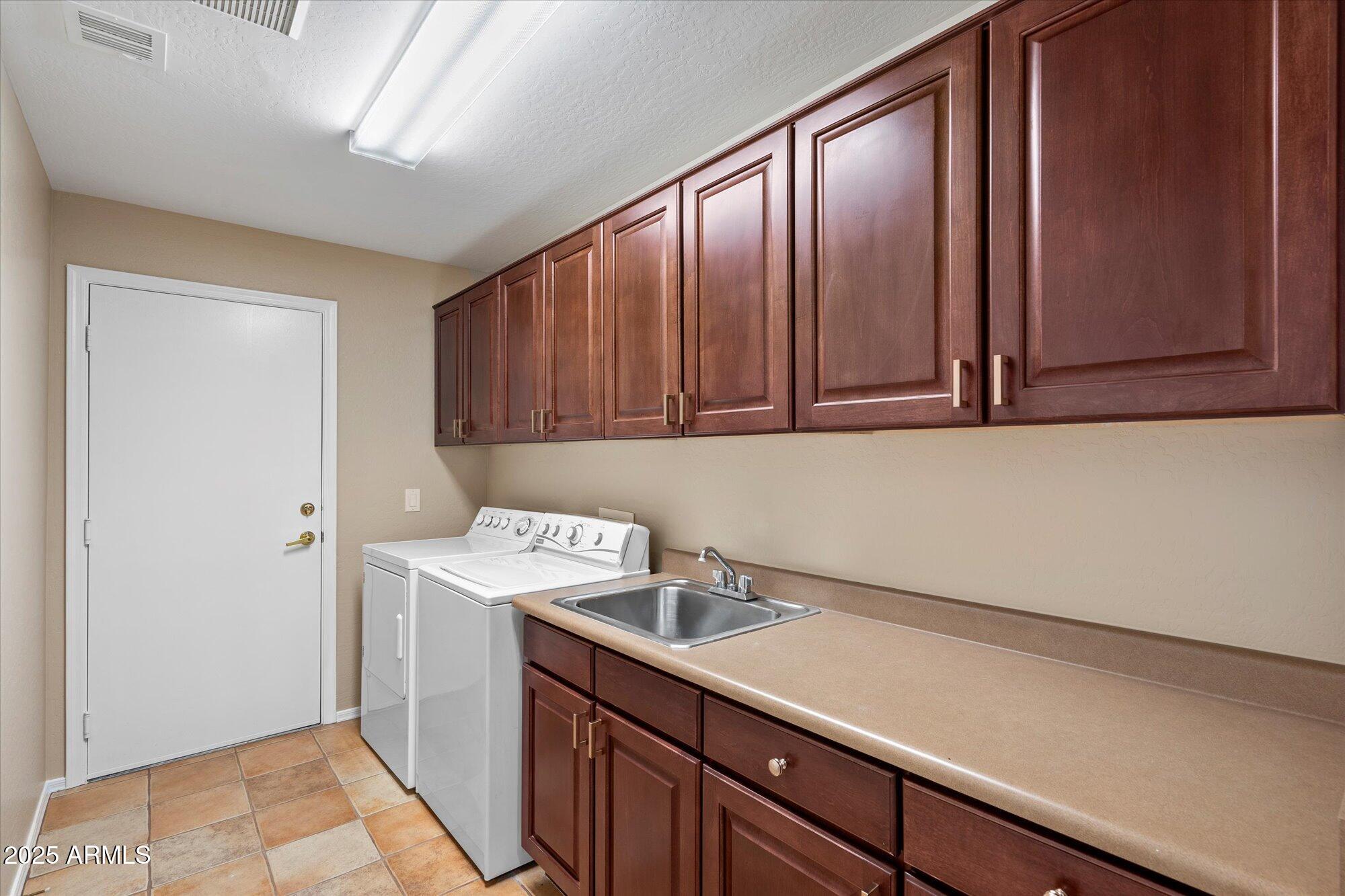 19700 North 76th Street, Unit 1103 Scottsdale, AZ 85255 - Photo 10 of 18 a utility room with a sink
