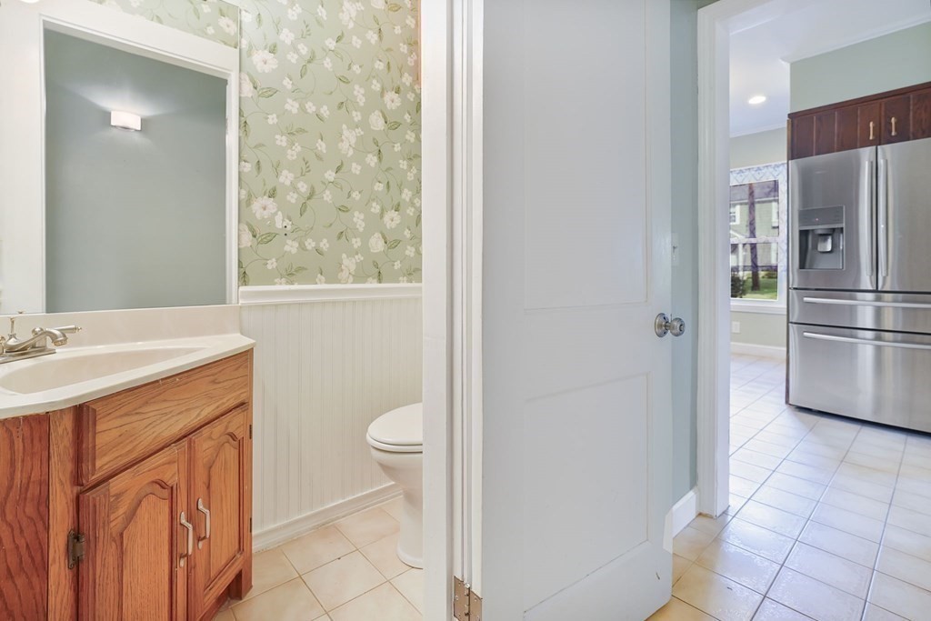 86 Lincoln Road Longmeadow, MA 01106 - Photo 8 of 42 a bathroom with a toilet sink and a mirror