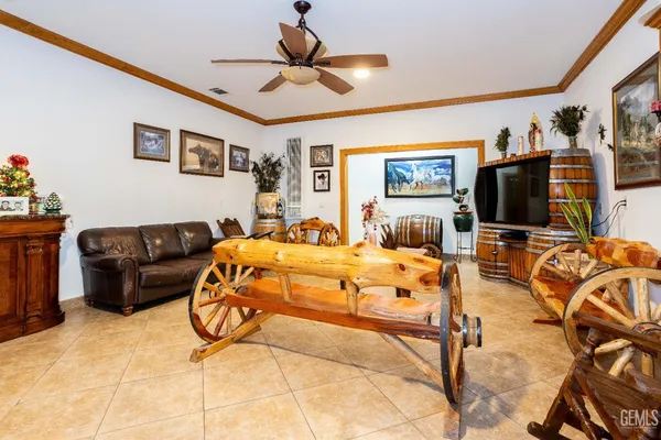 a large kitchen with stainless steel appliances granite countertop a stove a sink and a microwave