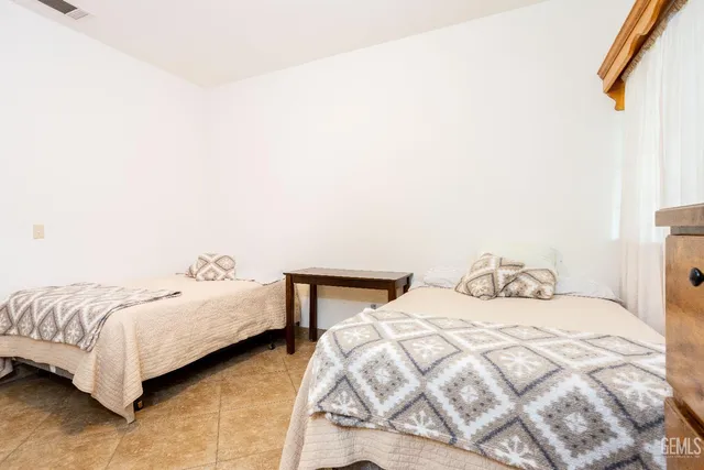 a view of a park that has a tree on the side of it