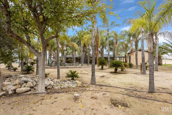 a view of a backyard of a house