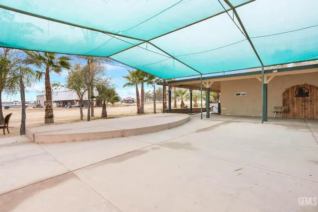 a living room with furniture and outdoor space