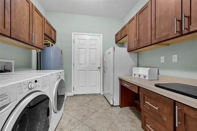 a view of livingroom with washer and dryer