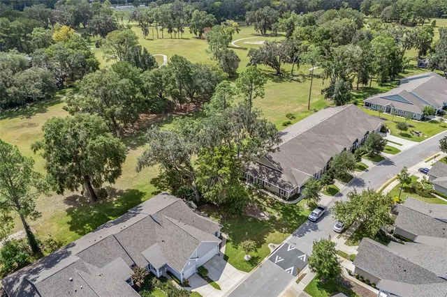 an aerial view of a house with a lake view