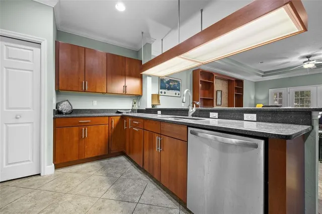 a kitchen with stainless steel appliances granite countertop a sink and cabinets